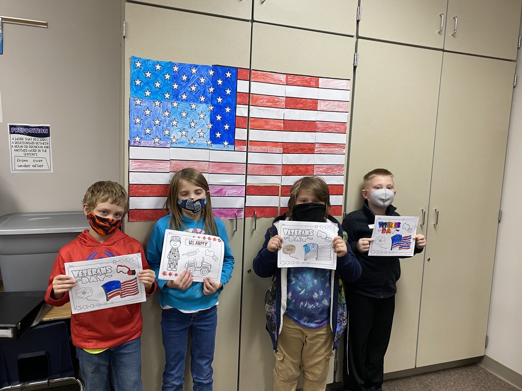 Students in Mrs. Evans' class create a group flag for Veterans Day!