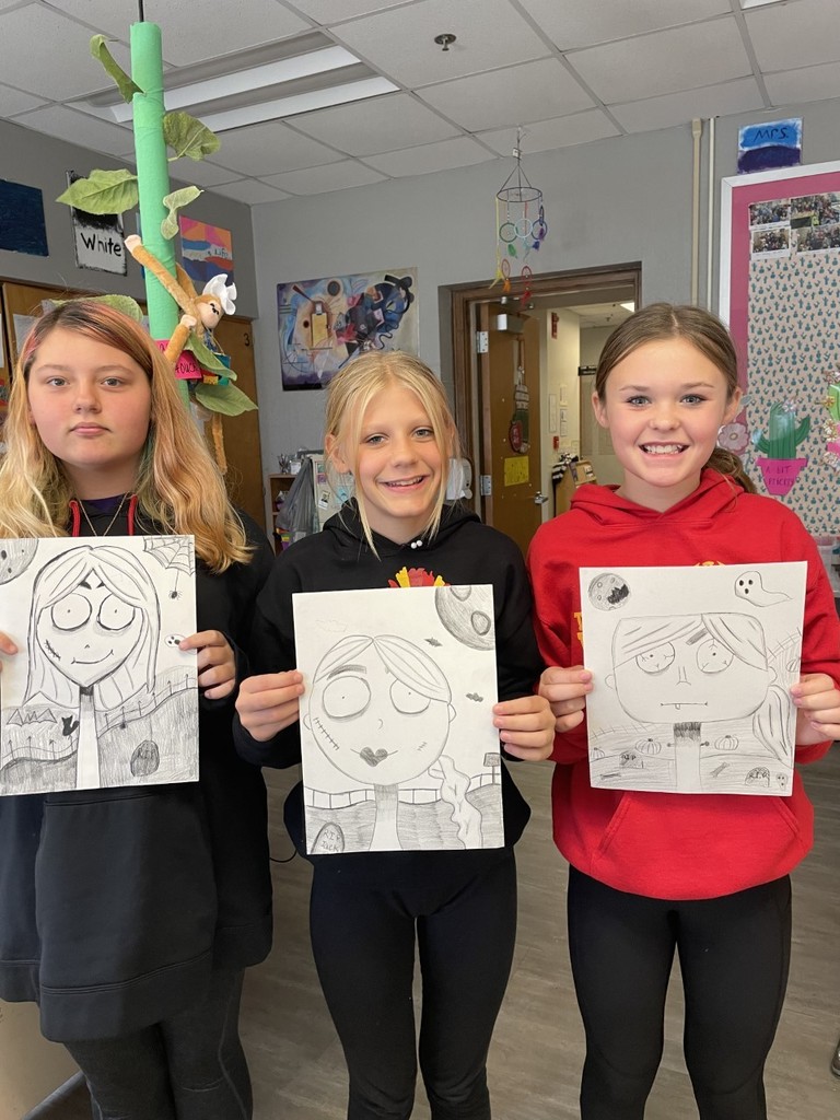The 6th graders created self-portraits in the style of Tim Burton.