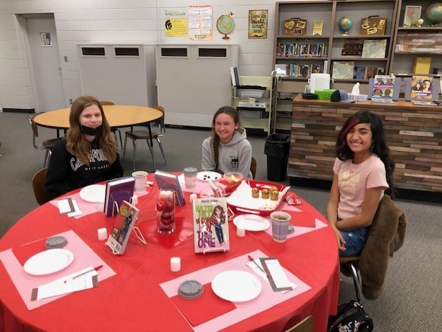 7th Graders are all smiles at the Bistro!  These students rated the books in several categories.