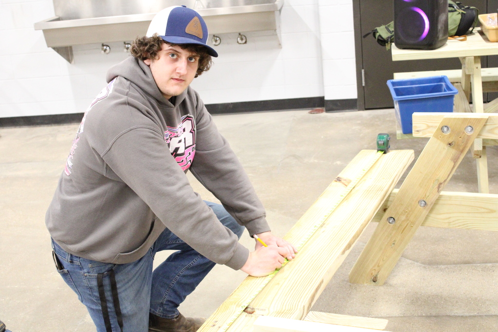 CHS Student working on a bench.