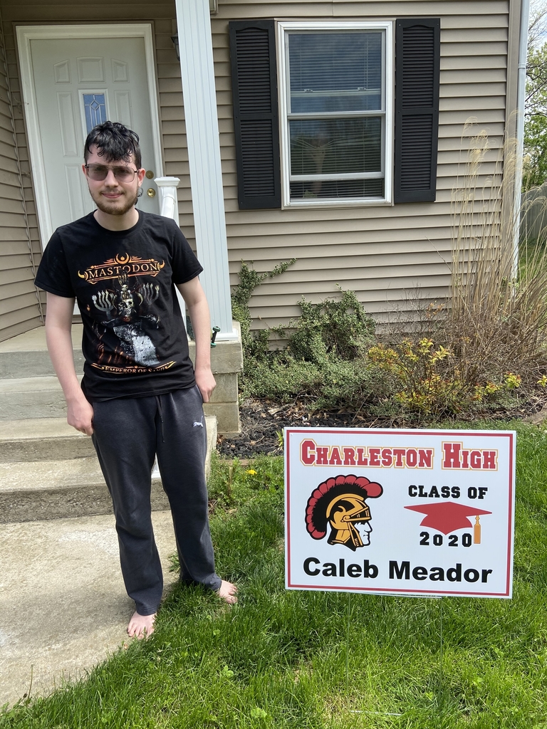 Student with yard sign