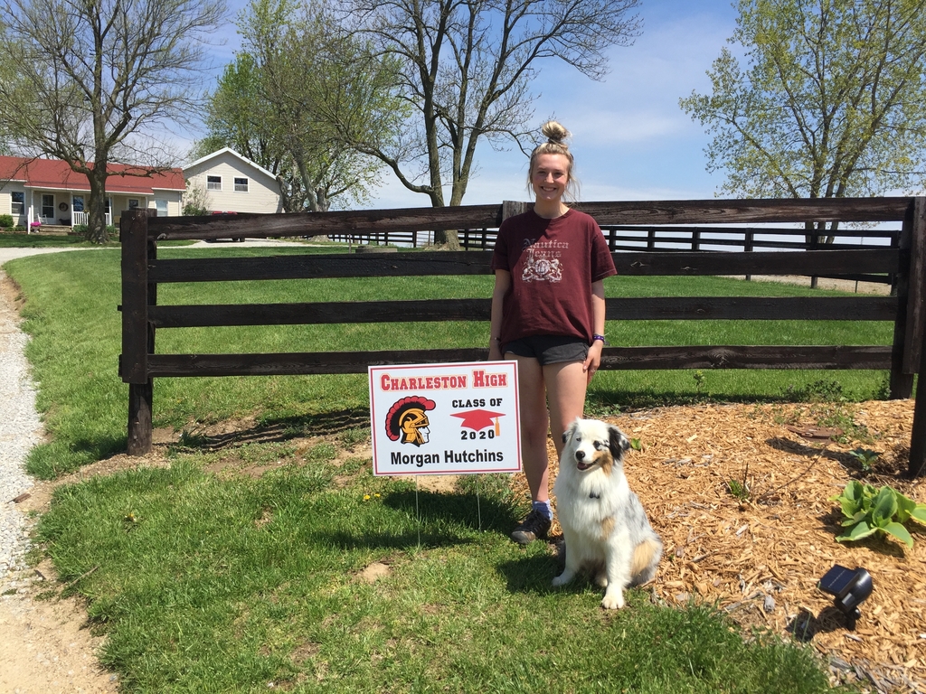 Seniors student and her dog with sign